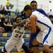 Pioneer and Salem players compete for possession of the ball early in the game during the Chelsea High Basketball Tournament on Friday, Dec. 28. Daniel Brenner I AnnArbor.com